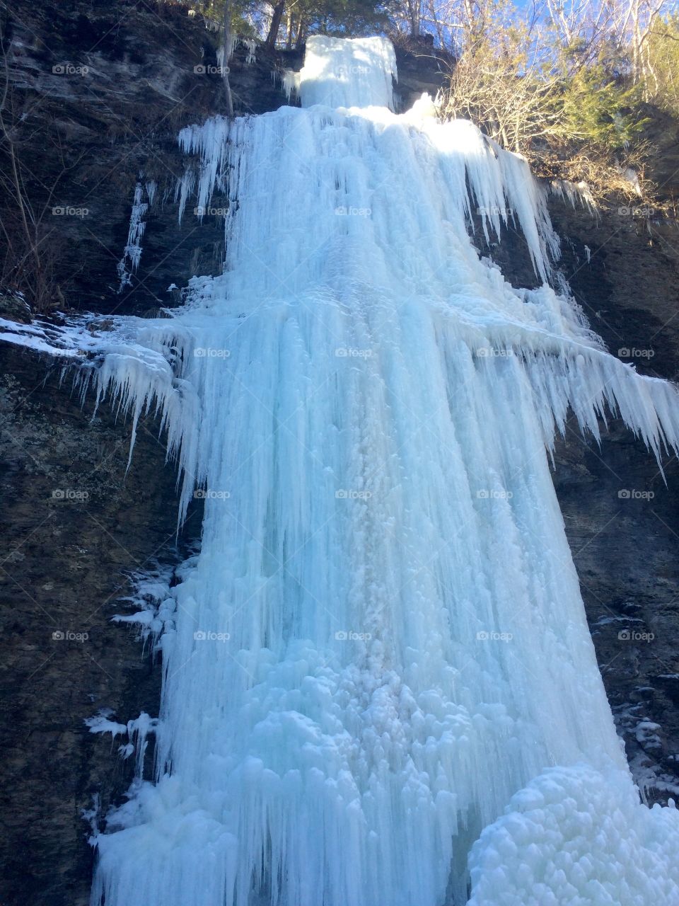 Low angle view of frozen waterfall