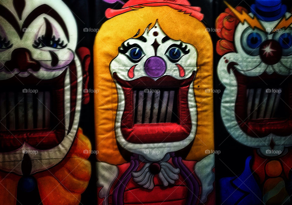 Scary eerie clown at a carnival