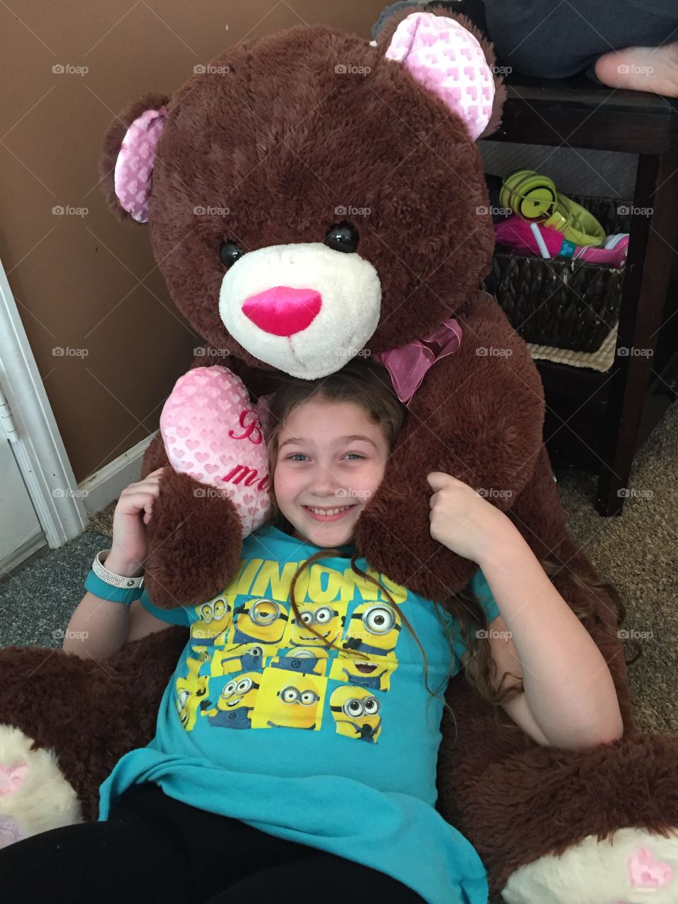 Girl playing with teddy