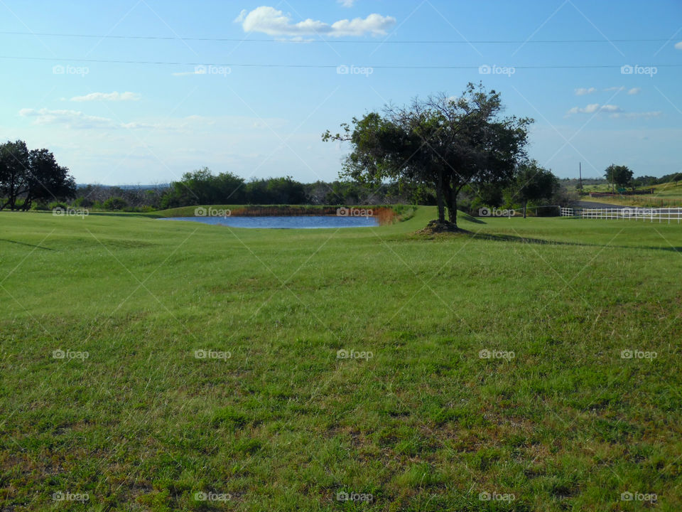 farm ranch pic 2. this is another picture of the same ranch where there is a pond near the road on the way to possum kingdom lake