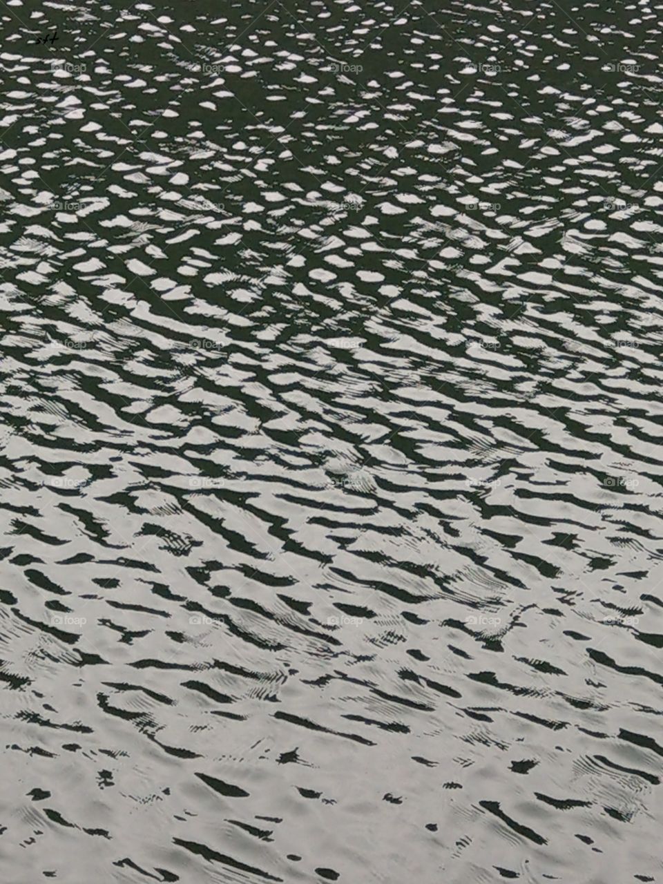 The water pattern for lake, a natural beauty looks calm, peaceful and neat.