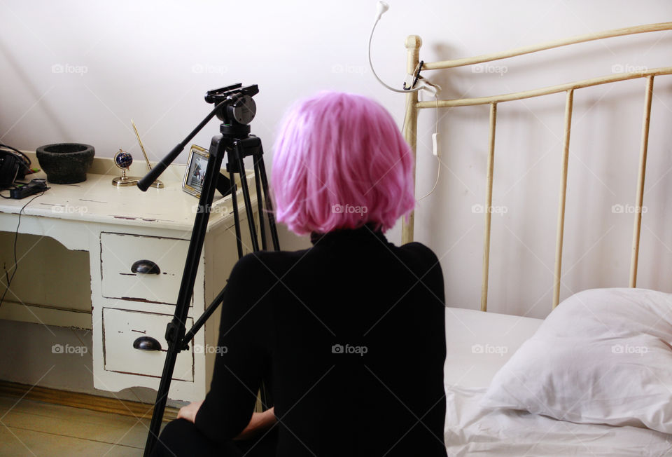 Anonymous woman with pink wig, working time