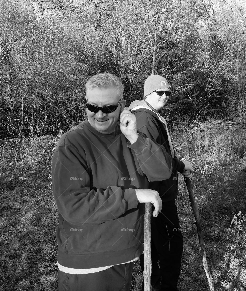 Two man standing in forest