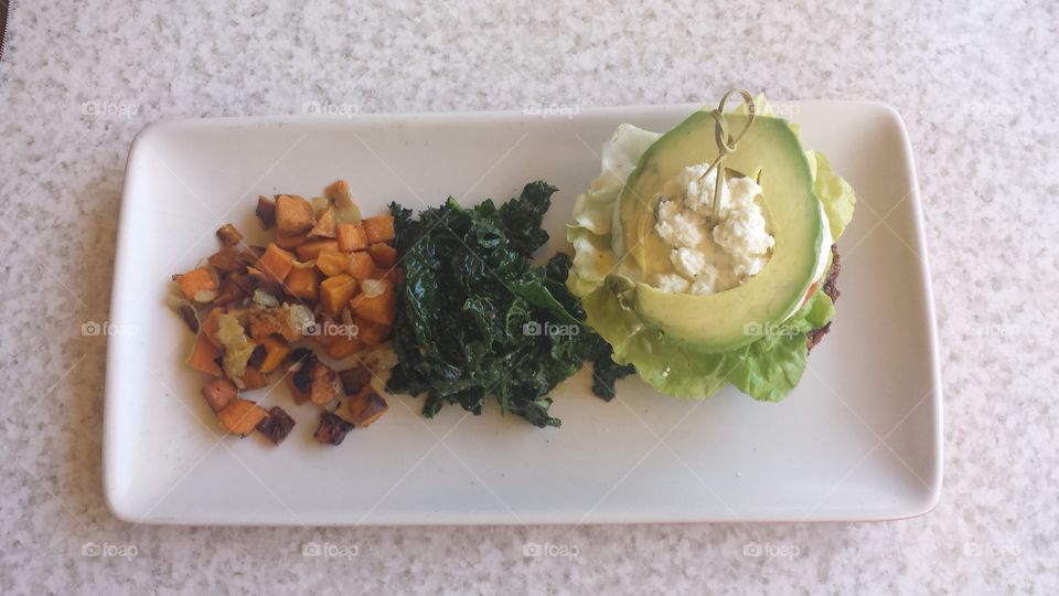True Food. True Food always does it right. Sweet Potato Hash, Kale Salad, and half of a Quinoa Burger.