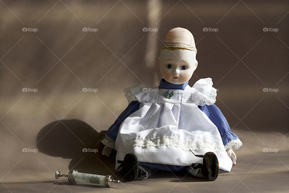 old doll and cannula