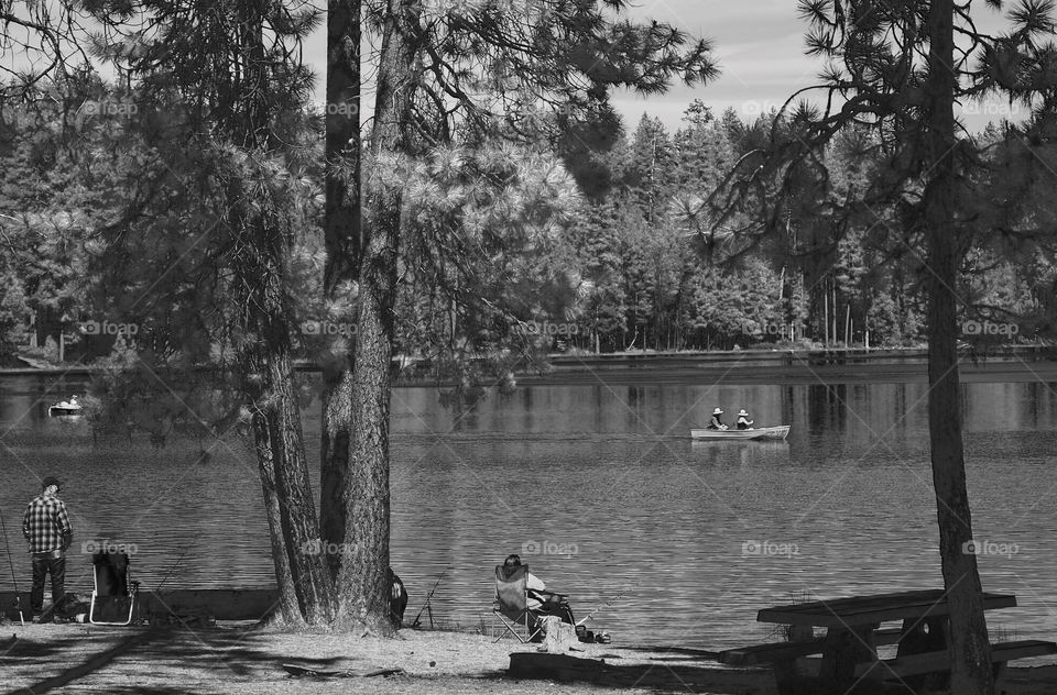 Fisherman and boaters enjoy a nice summer day on a high mountain lake in the Deschutes National Forest in Central Oregon. 