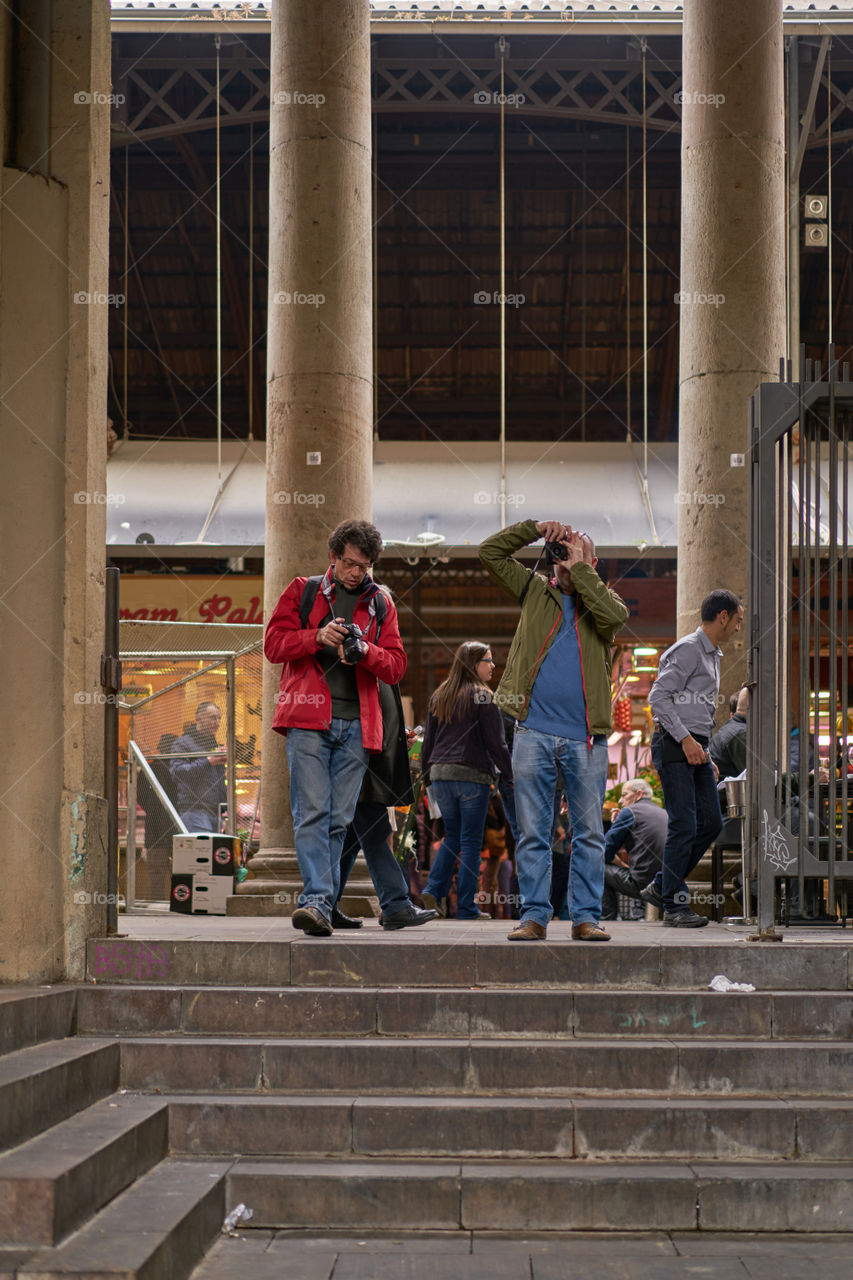 Two male photographers clicking photograph