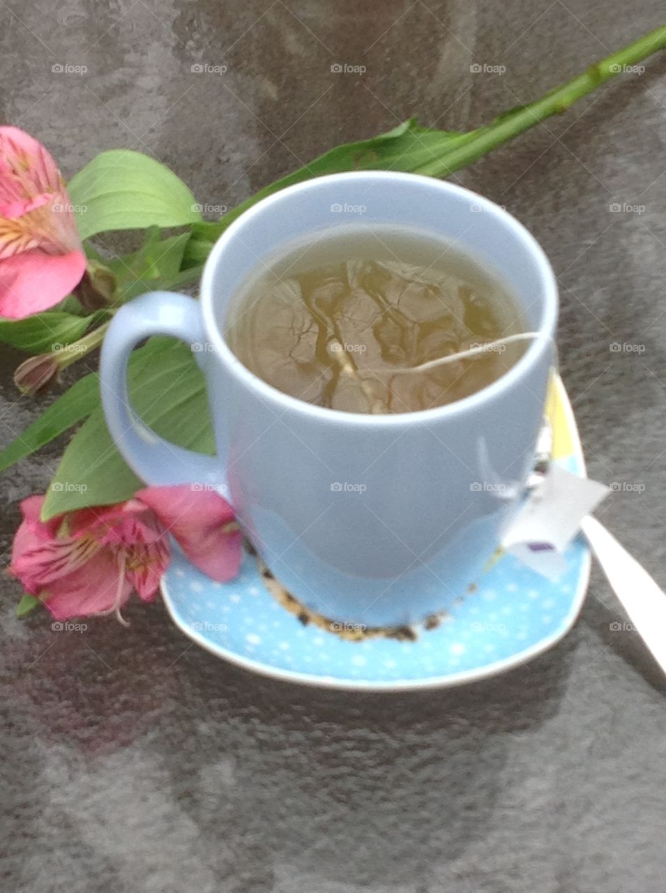 Having a cup of tea outdoors enjoying the beautiful Spring weather.