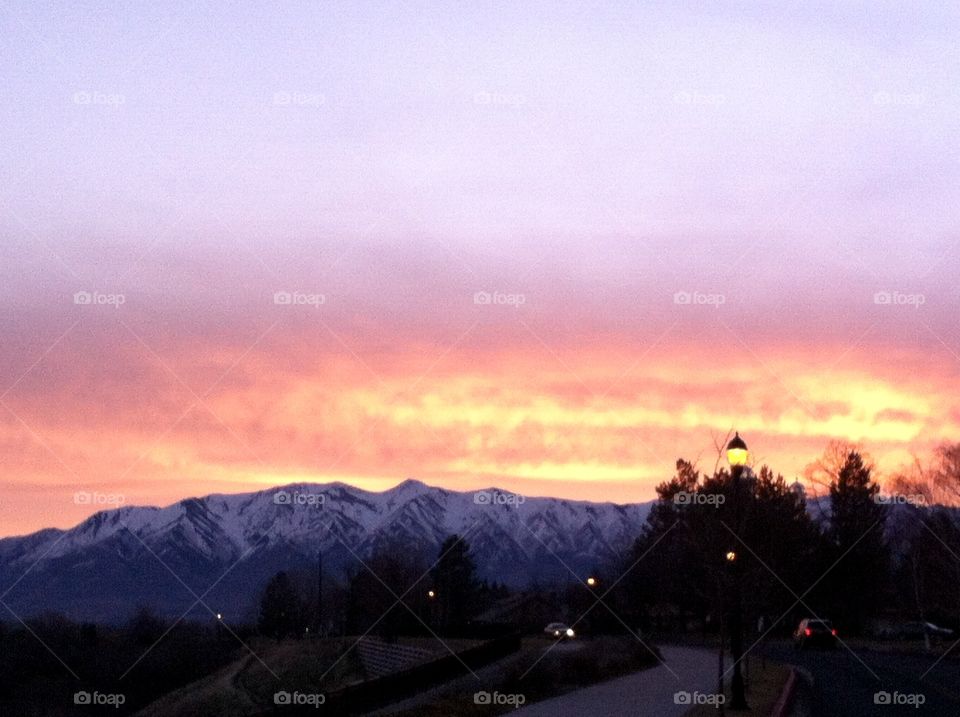 Walking along this trail gave a great view of the snow-touched mountains set against a sunset.