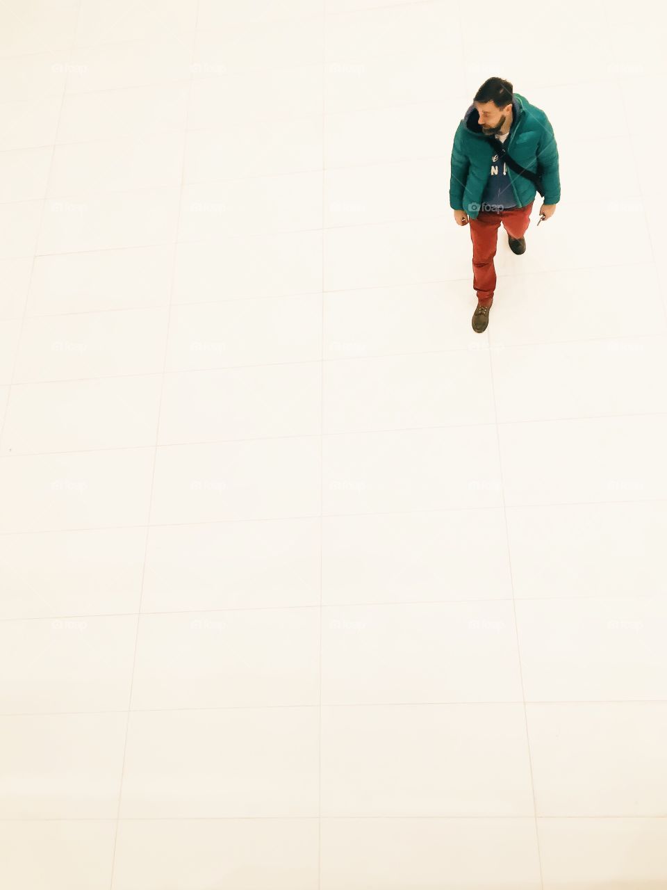 High angle view of a man walking on floor