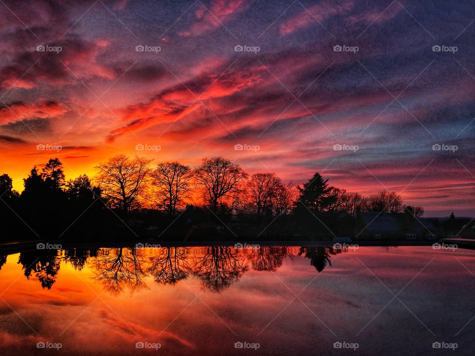 January 2021 Sunset ... Snow turned to ice as temperatures dipped but with a beautiful blue sky all day long. Then tonight  as the sun set the sky turned deep red ! 