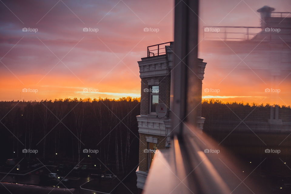 Sunset from the window with reflection