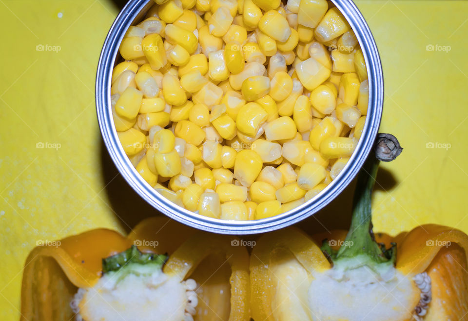Yellow bell pepper with corn seeds