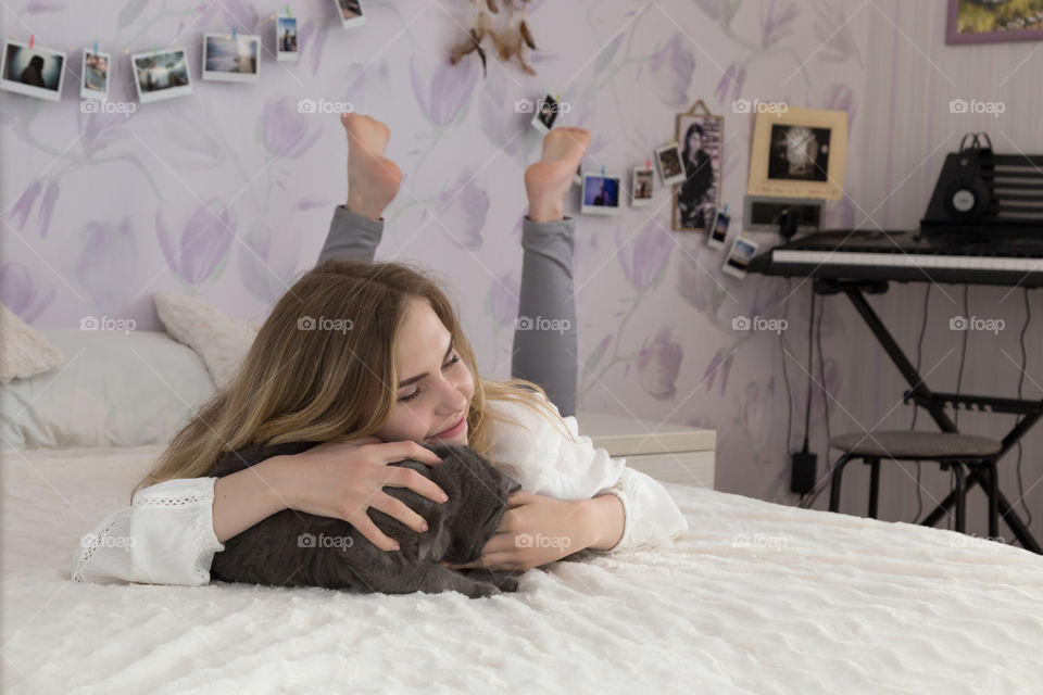 girl with cat in bedroom