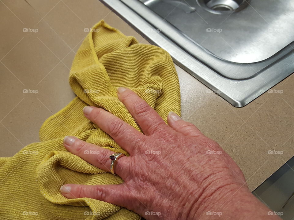 Woman cleaning the kitchen