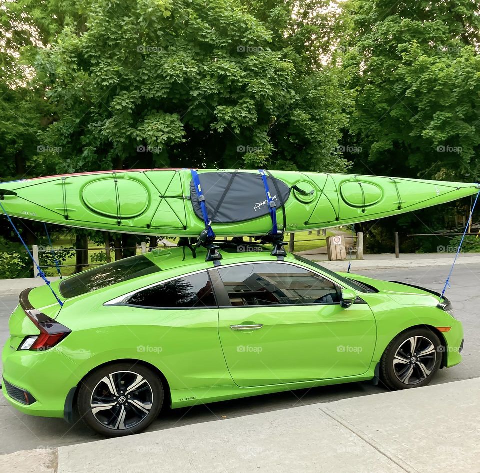 I am still not sure how this person found a kayak to match the identical green of their car.