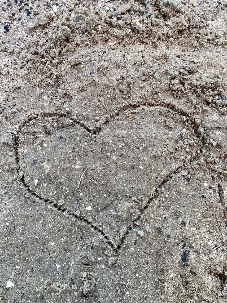 Heart drawn in sand