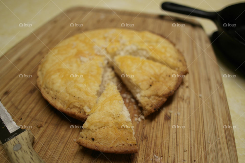 Making cornbread at home on a wooden board 