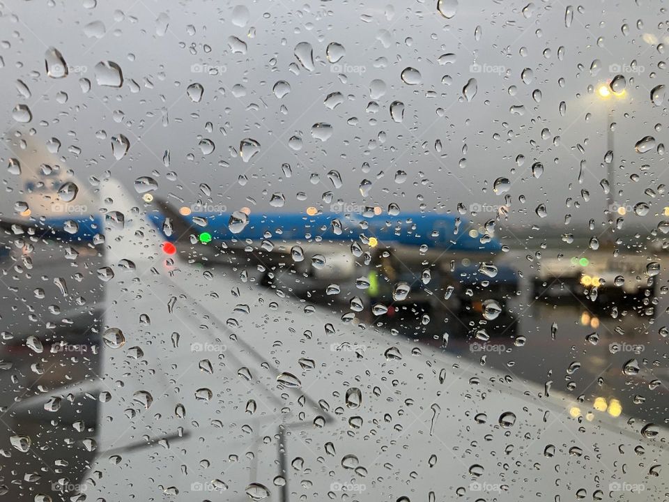 Raindrops on a plane window 