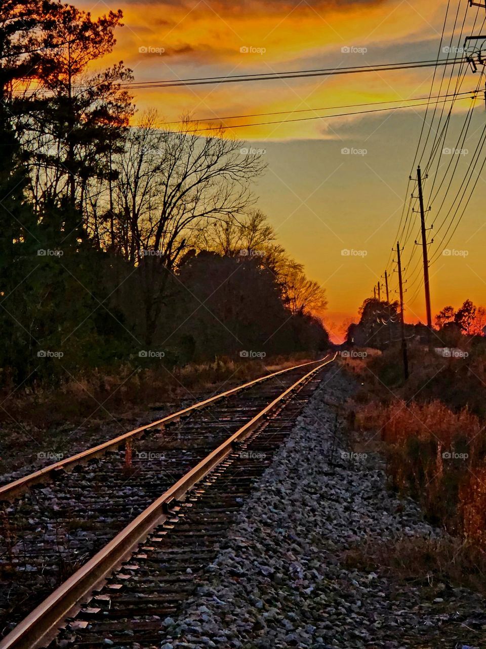 Sunset on railroad tracks