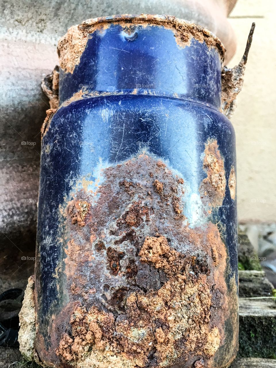 Rusted old blue tin can lantern pail unearthed from back yard 