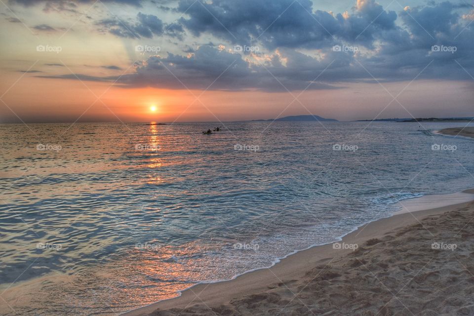 Sunset on summer beach. Greece Sunset on summer beach