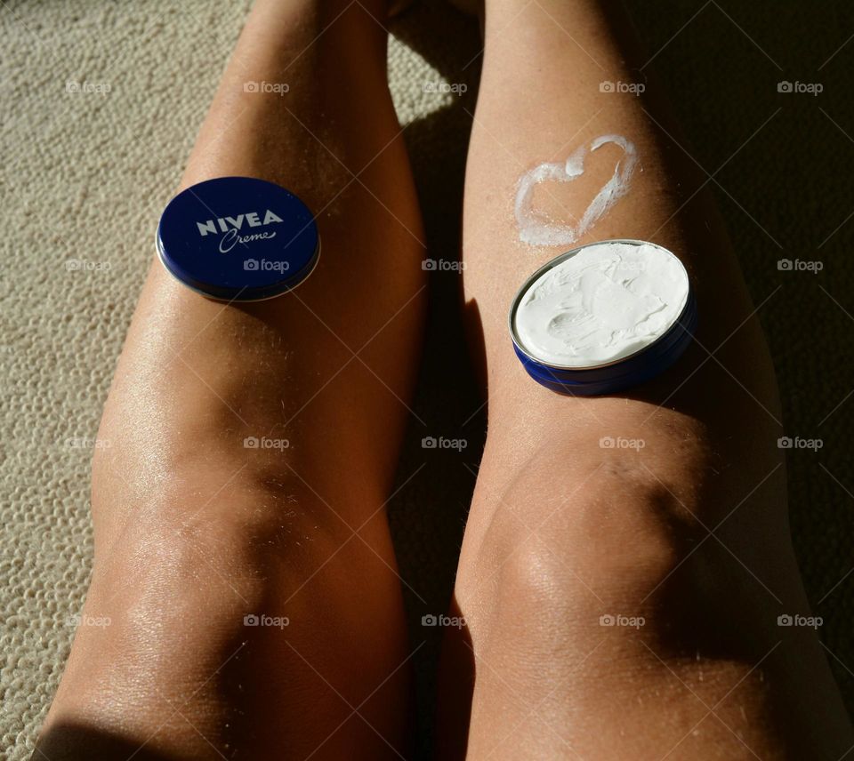 Nivea cream and female legs with heart love Nivea brand