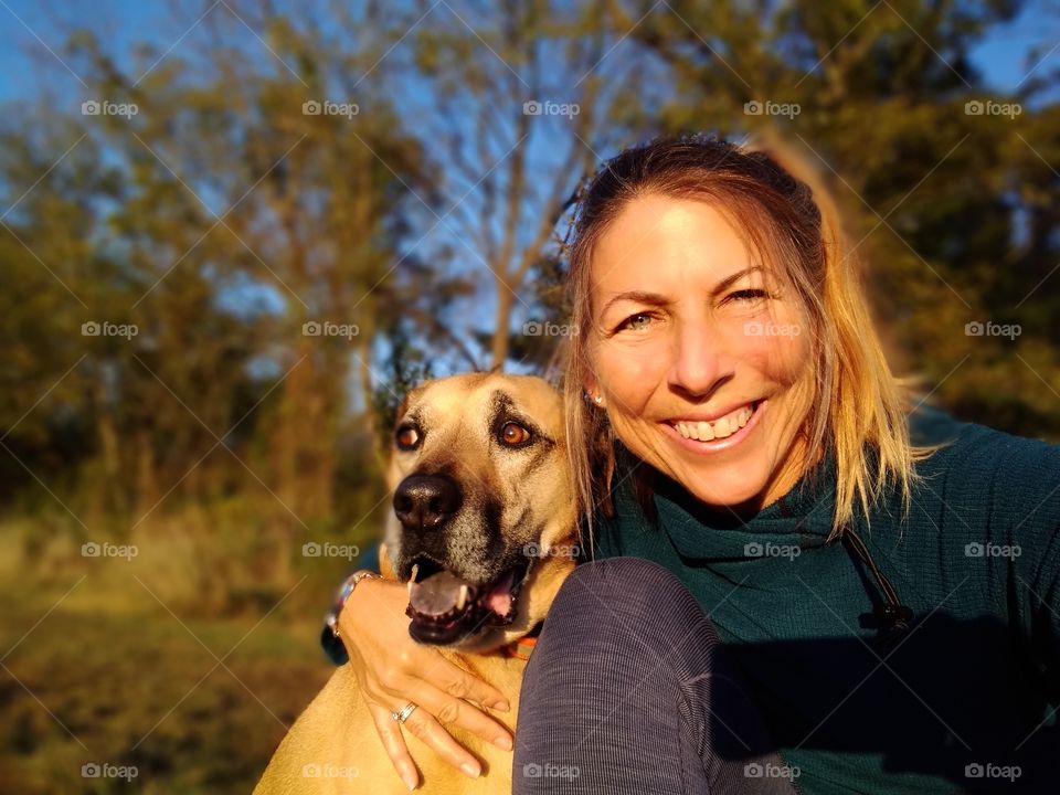 my best friend, my constant companion, my nature buddy and my heart. beautiful warm autumn light selfie with my dog taken in nearby field