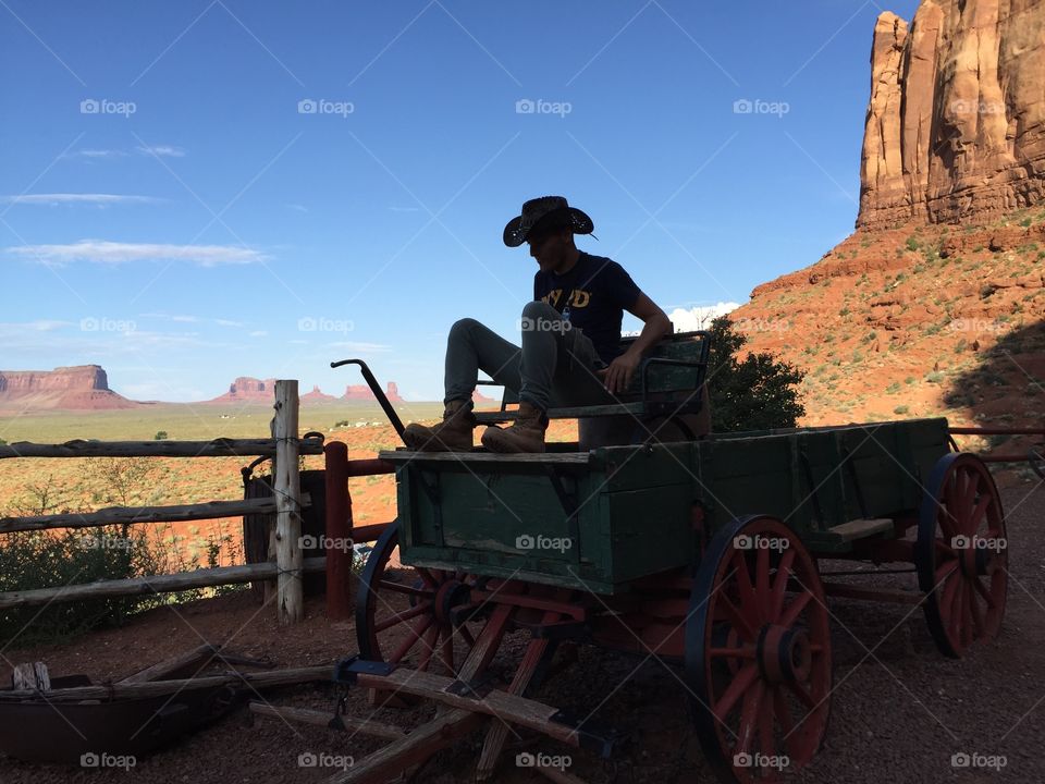 A beautiful western landscape with the unmistakable silhouette of a cowboy