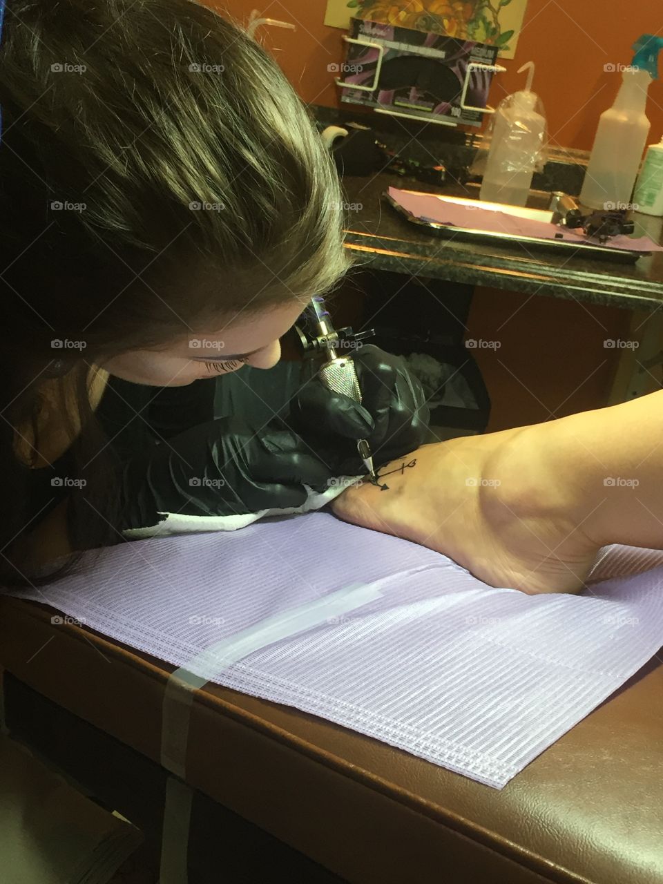 Tattoo artist at work. 