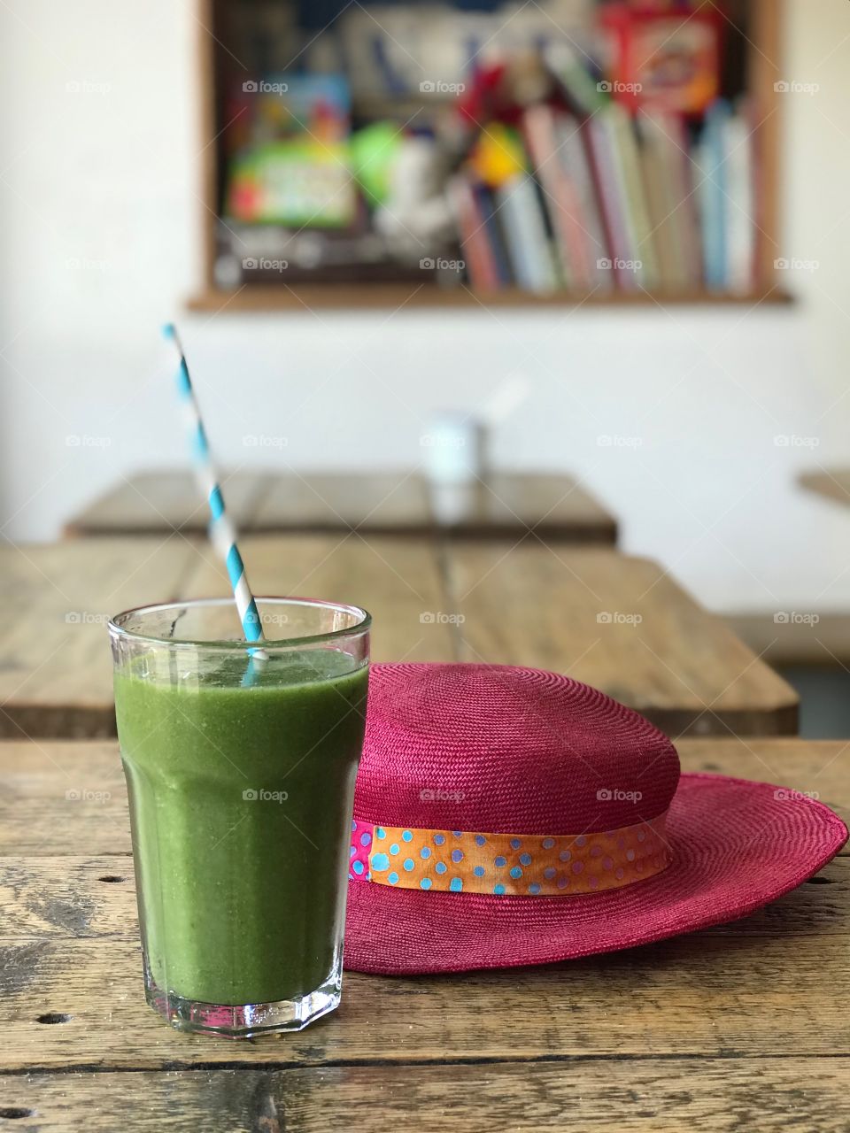 Green fresh smoothie with a hat