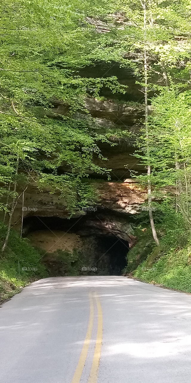road going through old railroad tunnel