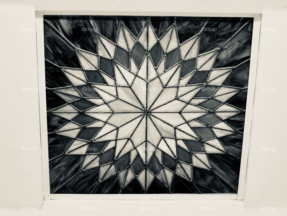 Stained glass on the ceiling in black and white 
