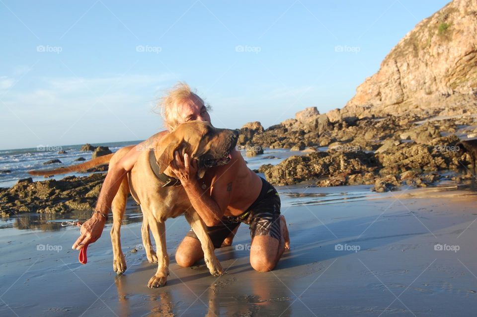 Man hugging dog 