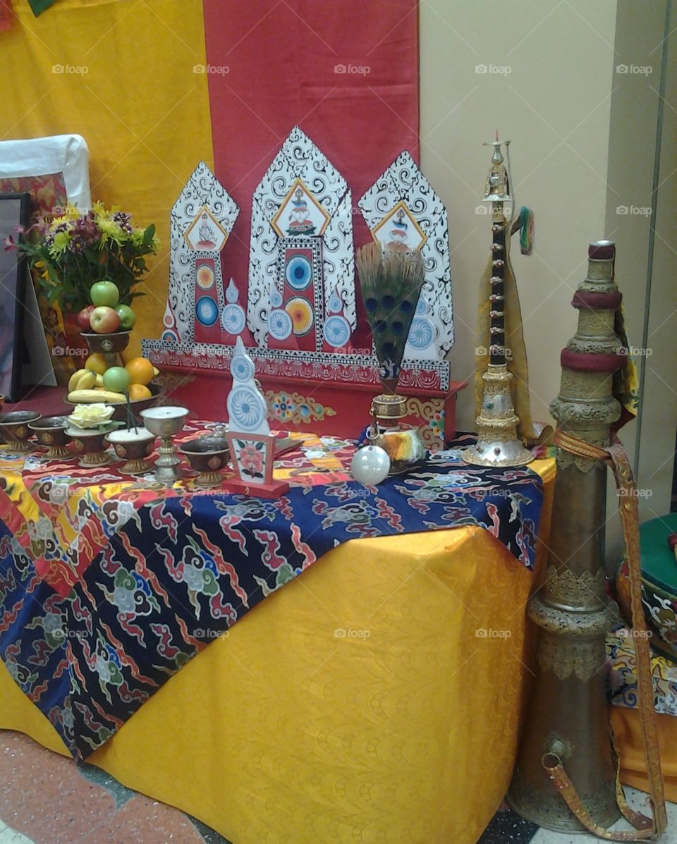 Tibetan Buddhist Altar with Traditional Musical Instruments and Seven Kinds of Offerings.