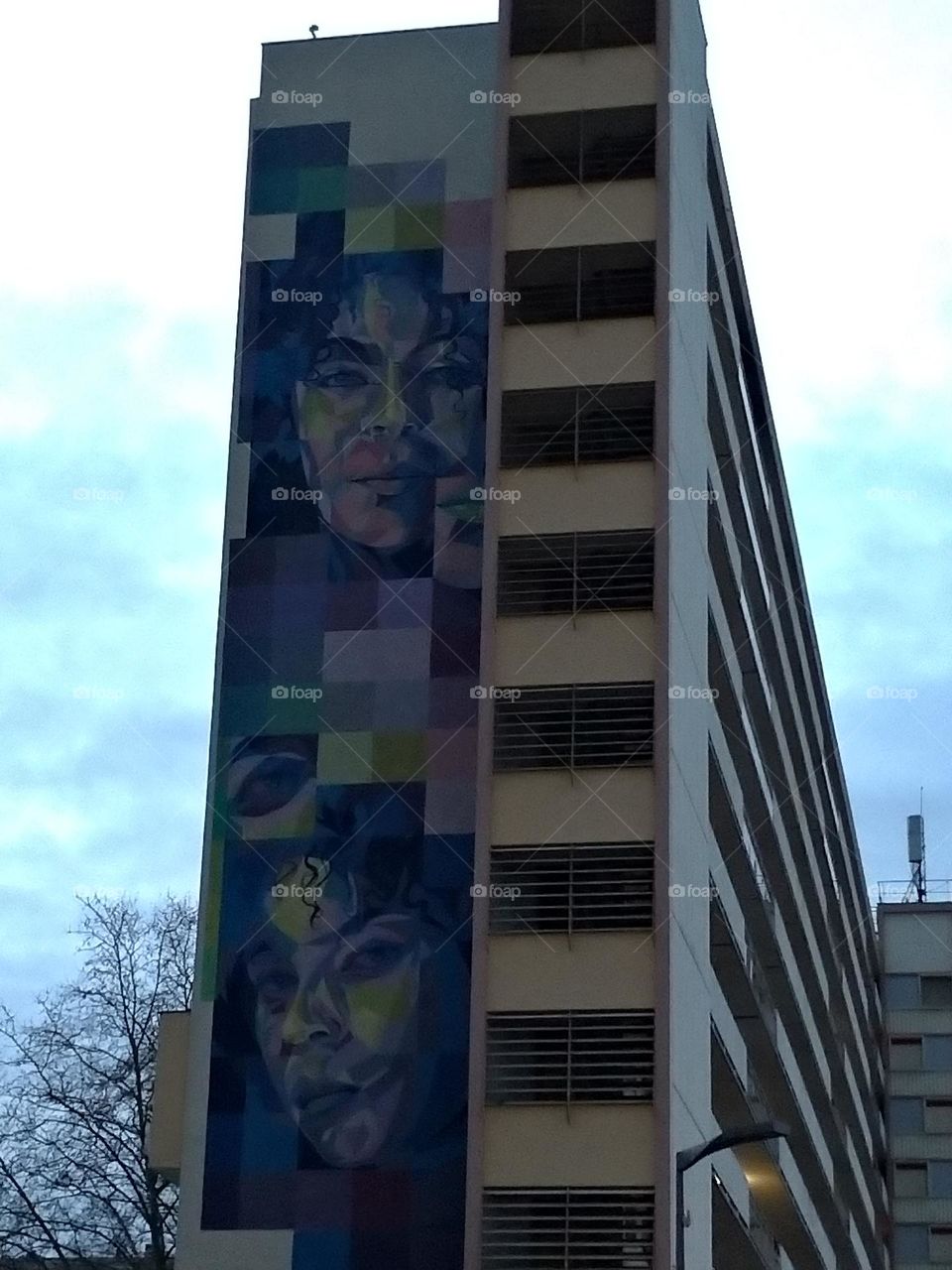 Giant graffiti woman portrait on building