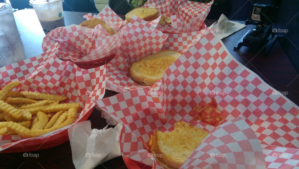 Fries and lots of grilled cheese on sourdough bread at a local diner.