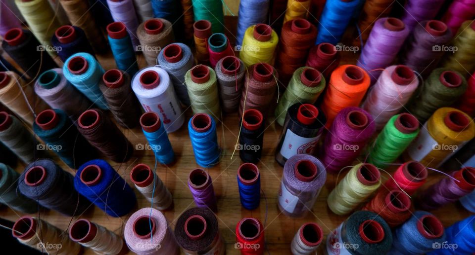 collection of sewing threads of various colors