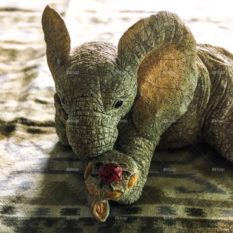 A 69¢ figure of an elephant with hanging out with his friend ladybug.