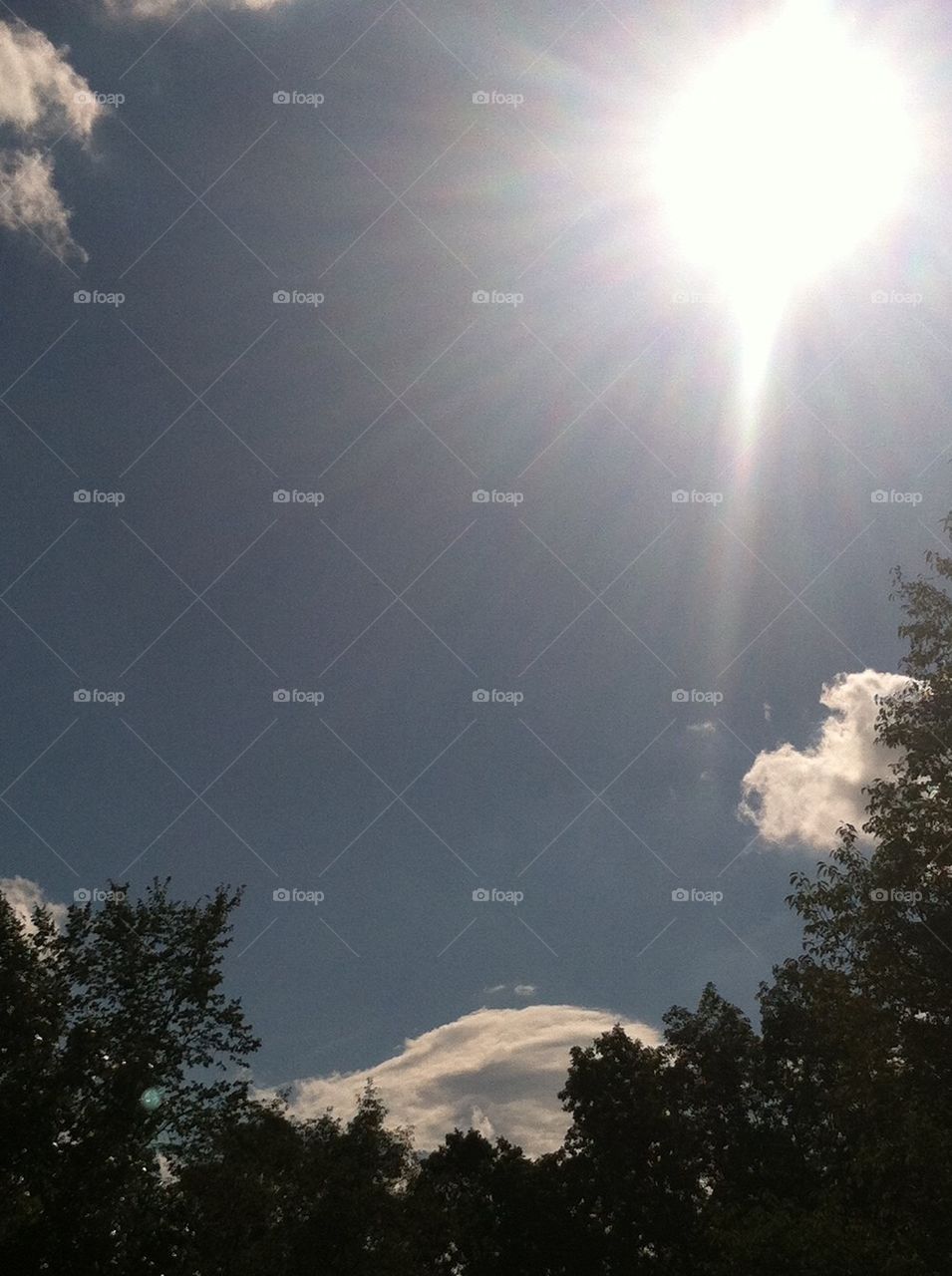 Bright sun , blue sky 