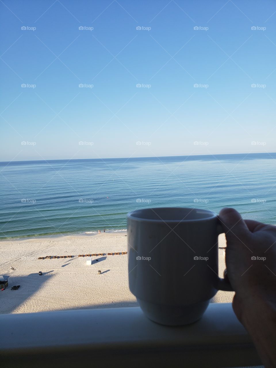 coffee cup while relaxing on balcony at beach @sellsaga