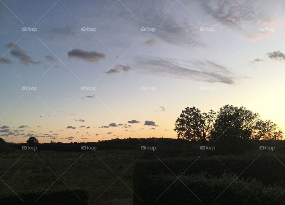 The view from my house at sunset. I love the silhouetted landscape and the almost ‘messy’ nature of the clouds above.