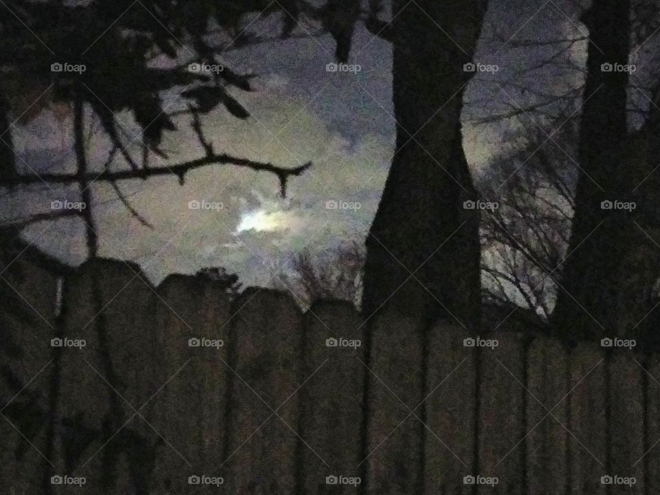 moon emerging from the clouds