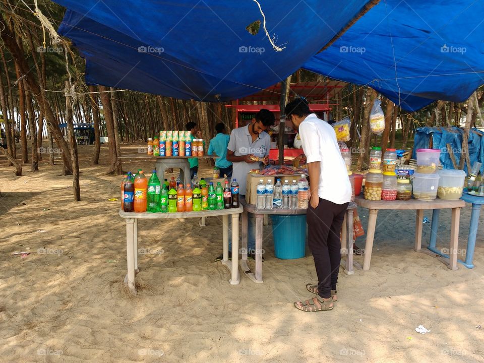 buying snacks from a village stall