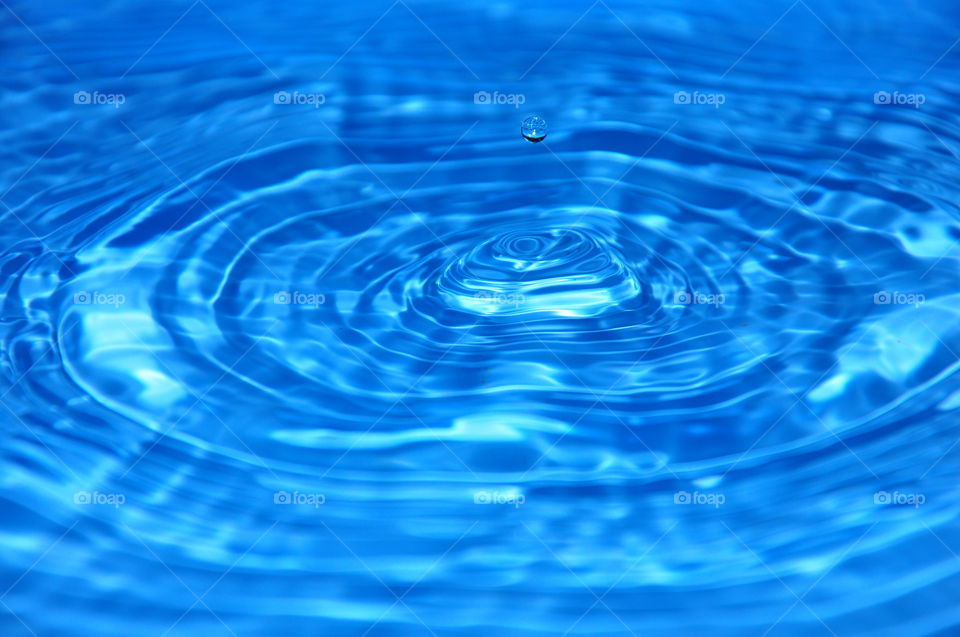 Detail of drop falling in water