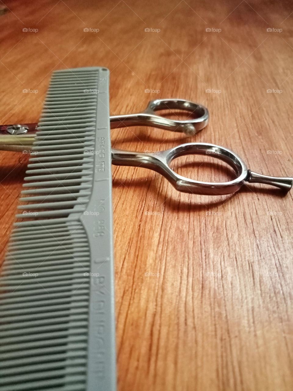 Hair Scissors and comb on the table
