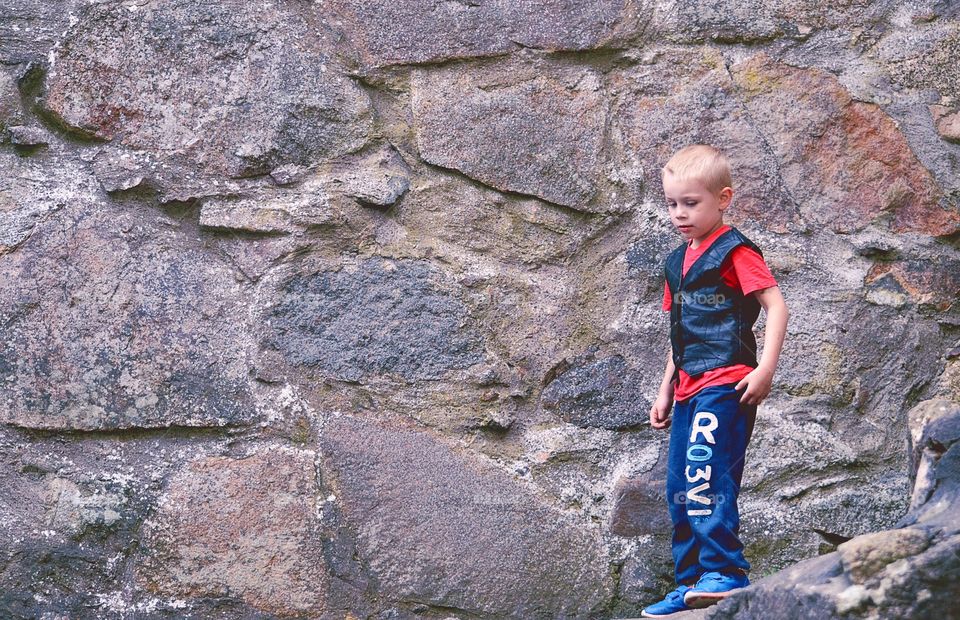 Boy inside ruins. Inside old ruins of a castle