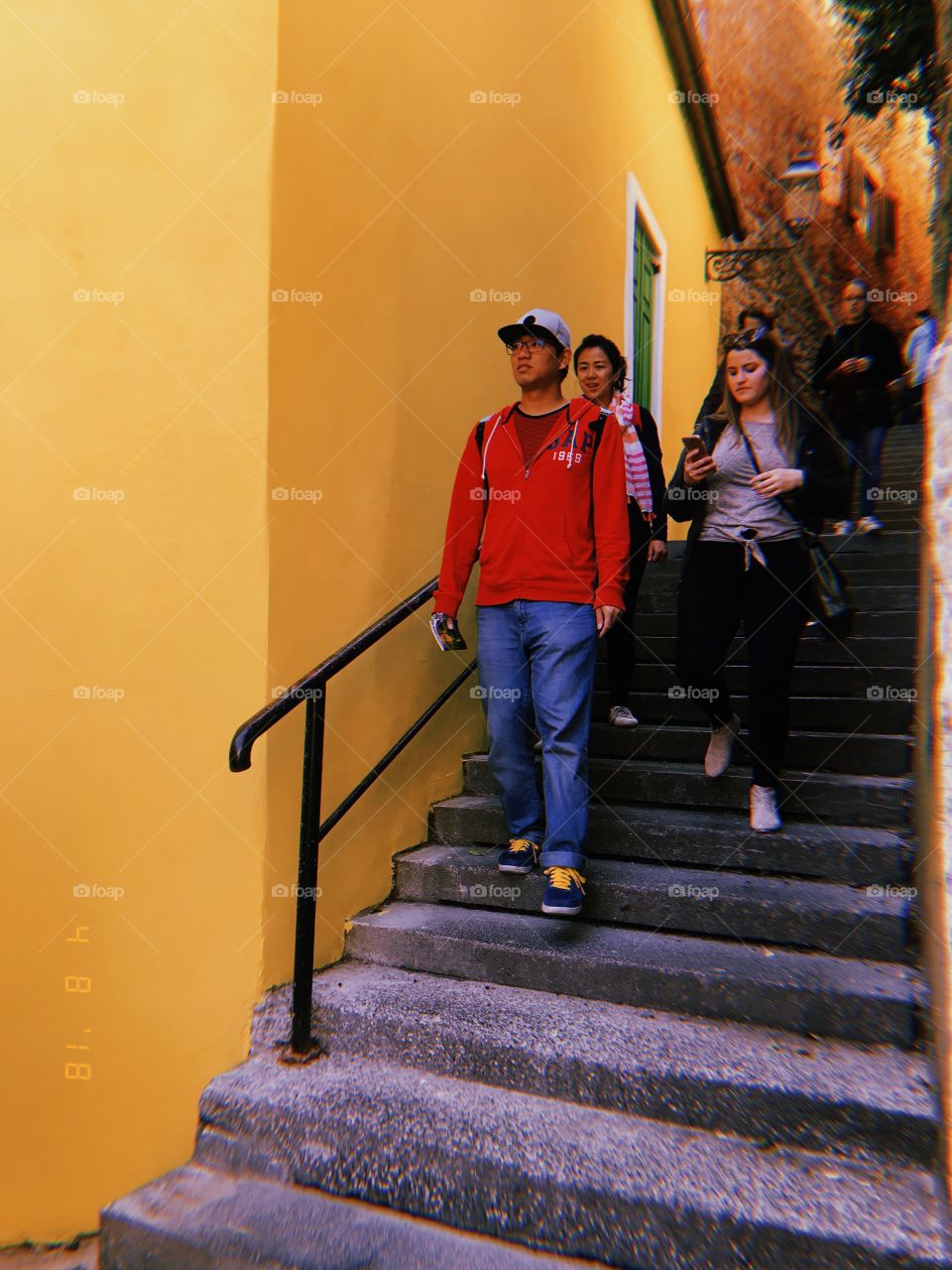yellow wall stroll in Zagreb Croatia. Walking. People. Colorful. Wall. Bright