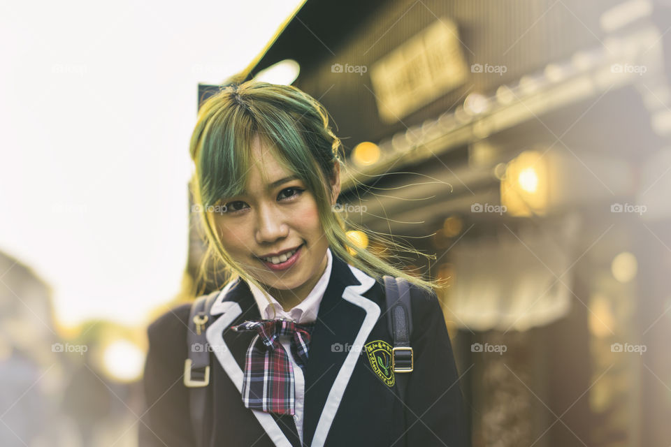 Portrait of Japanese school girl cosplay in the street of Kyoto