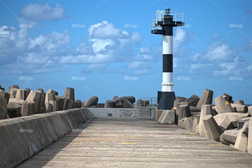 The Lighthouse Under The Blue Sky